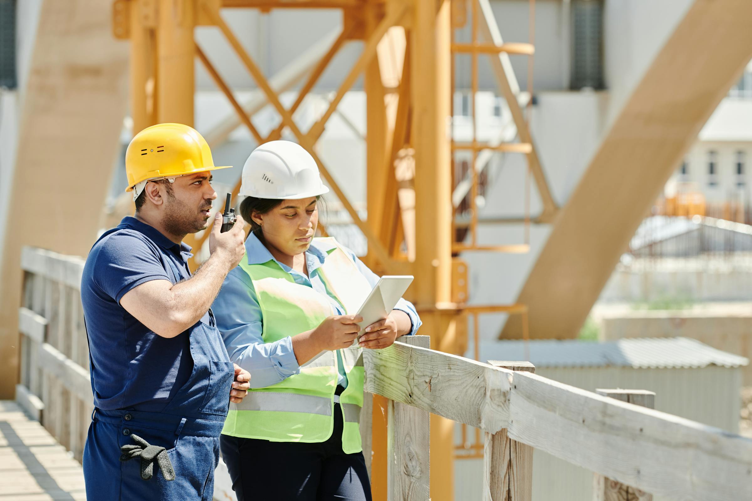 Site supervisor recording attendance on a tablet